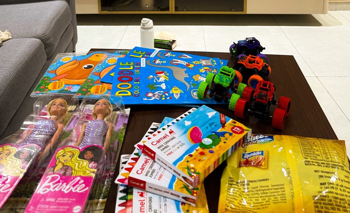 Toys, coloring books and crayons prepared for children